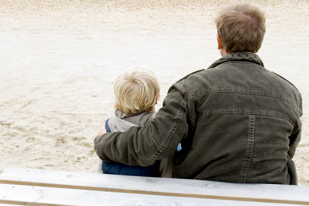 father and son sitting together