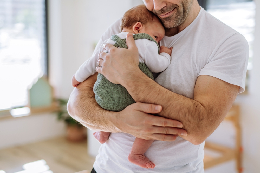 Close-up of father holding his little son.