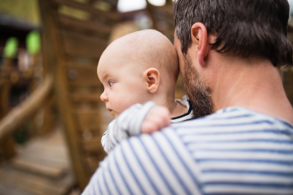 Father with little baby, summer day.